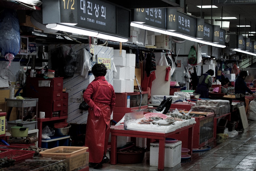 Jagalchi Fish Market Busan fishmonger vendor red