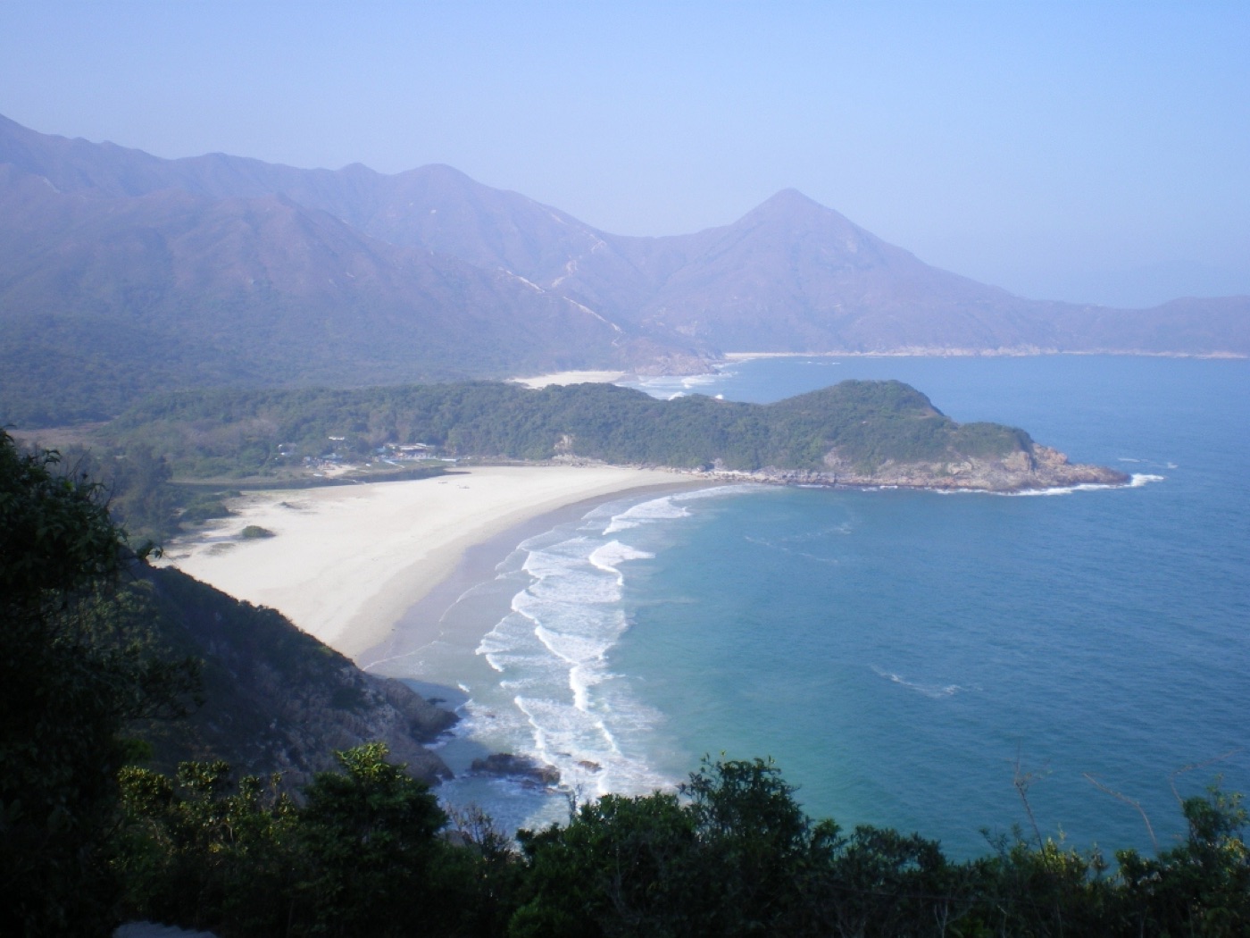Tai Long Wan beach in Sai Kung, Hong Kong, with turquoise water and golden sand
