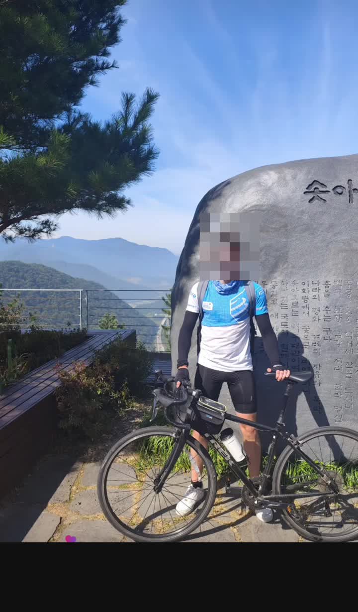 Cyclist mountain summit viewpoint Mungyeong Korea
