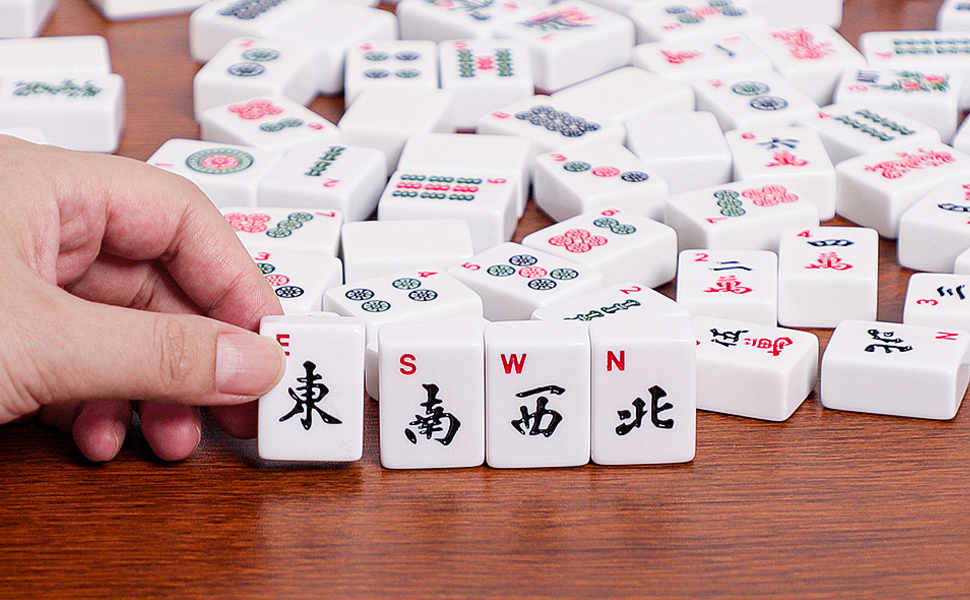 GUSTARIA American Mahjong Game Set, hand holding wind direction tiles