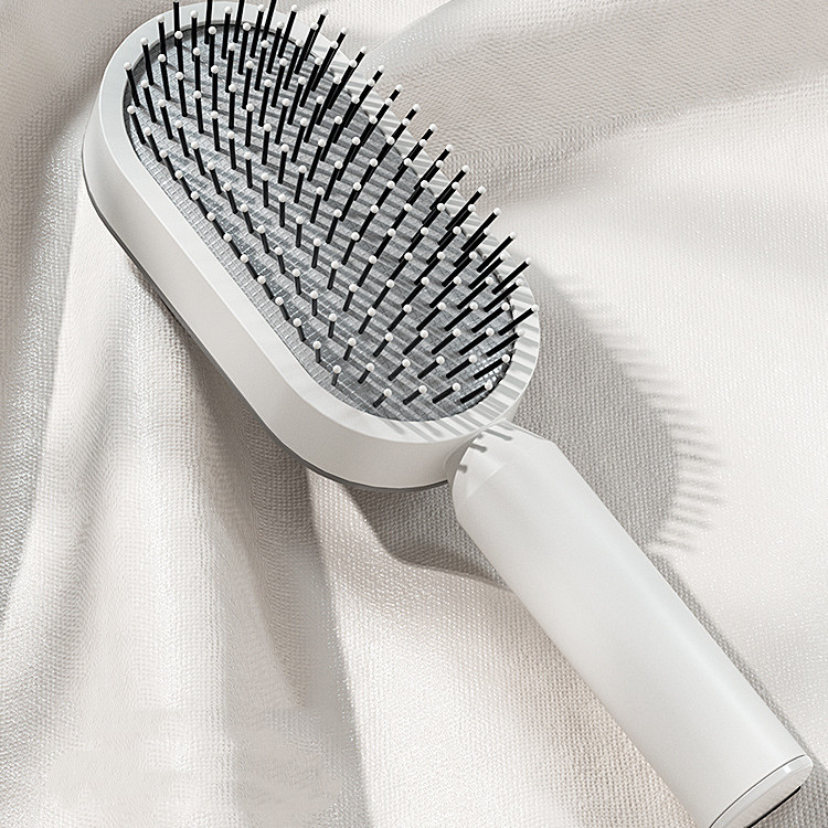 Self-cleaning hair brush with one-press button